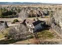 Lovely aerial view of a suburban home with a spacious backyard and a well-maintained fence and garden at 7202 Snow Peak Ct, Niwot, CO 80503