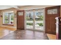 Bright foyer with tile flooring and a view of the front yard and neighborhood at 6336 S Newland Ct, Littleton, CO 80123