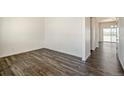 Spacious, light-filled room featuring modern flooring and an open layout at 2212 Crosswind St, Fort Lupton, CO 80621