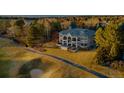 Beautiful home with a view of the lush golf course, mature trees, and perfectly manicured lawn at 73 Glenmoor Dr, Cherry Hills Village, CO 80113