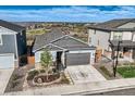 A high-angle aerial view of the home showcasing its well-maintained surroundings and neighborhood at 476 Silver Rock Trl, Castle Rock, CO 80104