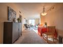 Inviting living room with neutral tones and a sliding glass door to the balcony at 1020 15Th St # 32K, Denver, CO 80202