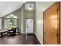 Spacious foyer with high ceilings, hardwood floors, and a large window for ample natural light at 8918 W 101St Ave, Broomfield, CO 80021