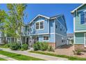 Well-maintained home featuring neat landscaping and side yard with gravel path at 18947 E 57Th Pl, Denver, CO 80249