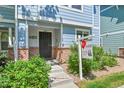 Close up view of the front of the house with a sign for HomeSmart Realty Group at 18947 E 57Th Pl, Denver, CO 80249