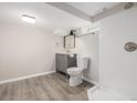This bathroom features neutral paint, updated vanity and a sleek shower at 118 S Dale Ct, Denver, CO 80219