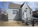 Charming cottage home featuring a well-maintained front yard, neutral paint and a peaked roof line at 118 S Dale Ct, Denver, CO 80219