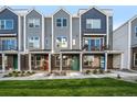 Attractive townhouse exteriors featuring colorful doors, professional landscaping and inviting curb appeal at 888 S Valentia St # 104, Denver, CO 80247