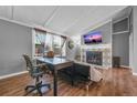 Living room features a fireplace and built-in shelving at 2017 Tulane St, Denver, CO 80260