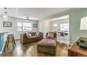 Spacious living room with hardwood floors and comfortable seating at 172 S Lowell Blvd, Denver, CO 80219