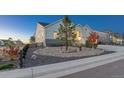 Modern farmhouse exterior with attractive landscaping and a two-car garage at 3308 Carabiner St, Castle Rock, CO 80108