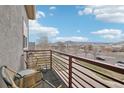 Cozy balcony with seating, overlooking a scenic view of the surrounding neighborhood and mountains at 3644 Pinedale St, Boulder, CO 80301