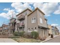Multi-story home with garage, multiple balconies, neutral color palette and nicely landscaped with various plants at 3644 Pinedale St, Boulder, CO 80301
