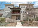 Neutral colored home with a small patio and walkway to the front door, nicely landscaped with various plants at 3644 Pinedale St, Boulder, CO 80301