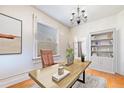 Well-lit home office with hardwood floors, large window, and built-in bookcase at 2350 N Ogden St, Denver, CO 80205
