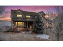 Beautiful two-story home with stone accents, covered porch, and landscaped yard at 7603 Yule Ct, Arvada, CO 80007