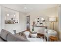 Stylish living room with a view into the kitchen, showcasing modern furniture and decor with hardwood floors at 3278 S Lafayette St, Englewood, CO 80113
