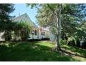 Quaint exterior with a manicured lawn and mature trees that enhance its natural beauty at 4675 S Yosemite St # 205, Denver, CO 80237