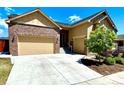 Beautiful home with a spacious driveway leading to a three car garage and landscaped front yard at 425 W 128Th Dr, Westminster, CO 80234