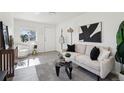 Bright living room featuring modern decor, stylish furnishings, and ample natural light, creating a welcoming space at 6691 Hooker St, Denver, CO 80221