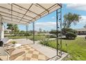 Inviting covered front porch with seating area, offering a relaxing outdoor space with views of the landscaped yard at 6691 Hooker St, Denver, CO 80221