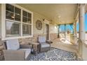 Charming front porch with comfortable seating and a cozy atmosphere at 3406 Purcell St, Brighton, CO 80601