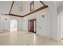 Bright foyer boasting high ceilings, marble floors, and elegant lighting at 5 Churchill Dr, Cherry Hills Village, CO 80113