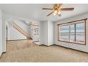 Bright living room with hardwood floors, large windows and a view at 14199 County Road 26, Fort Lupton, CO 80621