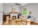 Cozy living area with a fireplace, comfortable seating, and natural light at 3002 Quitman St, Denver, CO 80212