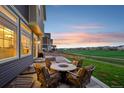 Inviting patio with comfortable seating and a fire pit, perfect for outdoor entertaining at 16595 E 110Th Ave, Commerce City, CO 80022