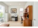Well-lit office with built-in cabinets, a large window, and hardwood floors at 1333 Raleigh St, Denver, CO 80204