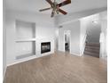 Living room featuring hardwood floors and a fireplace at 10094 Wyandott Cir, Denver, CO 80260