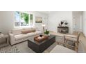 Bright and inviting living room with a large window and modern decor at 5554 Crystal Way, Denver, CO 80239