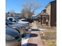 Exterior townhome community view featuring well-maintained landscaping and sidewalks connecting each cozy residence at 473 N Banner St # D, Elizabeth, CO 80107