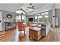 Bright living room with vaulted ceilings, mountain views, hardwood floors, and comfortable seating at 248 Copperdale Ln, Golden, CO 80403