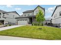 Beautiful two-story home with an attached garage and well-kept landscaping at 3365 S Poppy St, Morrison, CO 80465