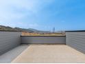 Balcony view overlooking a picturesque landscape and distant mountains on a sunny day with clear skies at 14422 Pansy Loop, Morrison, CO 80465