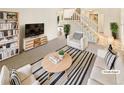 Bright living room with sleek furniture and a cozy striped rug at 14822 E Adriatic Pl, Aurora, CO 80014