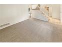 Spacious living room with neutral carpet and bright, natural light at 14822 E Adriatic Pl, Aurora, CO 80014