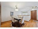 Cozy dining room with hardwood floors and a stylish chandelier offers a warm setting at 3079 E Long S Cir, Centennial, CO 80122