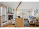 Bright living room with a vaulted ceiling and natural light from multiple windows creates a welcoming space at 3079 E Long S Cir, Centennial, CO 80122