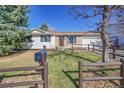 Charming single-story home with a well-maintained lawn, mature trees, and inviting curb appeal at 1342 S Andes St, Aurora, CO 80017