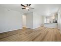 Bright and airy living room with hardwood floors and an open concept layout at 18338 E 93Rd Pl, Commerce City, CO 80022