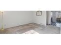 View of the living room with neutral walls and tile flooring at 892 Summer Dr # 15B, Highlands Ranch, CO 80126