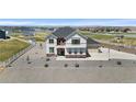 A sunny, charming two-story home with a three-car garage, well-manicured yard and beautiful stone accents at 16197 Paris Way, Brighton, CO 80602