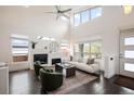 Inviting living room with a cozy fireplace, plush seating, and an abundance of natural light at 5050 Akron St, Denver, CO 80238
