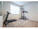 Bright bedroom, perfect for a home gym, with neutral carpet and natural light at 11830 W 52Nd Ave, Wheat Ridge, CO 80033