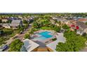 Beautiful aerial view showcasing the community pool with lounge chairs and lush green spaces at 2856 Shadow Lake Rd, Lafayette, CO 80026