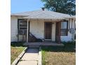 Charming white home featuring a covered porch and a well-maintained walkway at 150 Fulton Ave, Fort Lupton, CO 80621