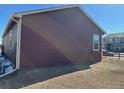 Partial view of home's side with yard at 2003 Monte Vista Dr, Lochbuie, CO 80603
